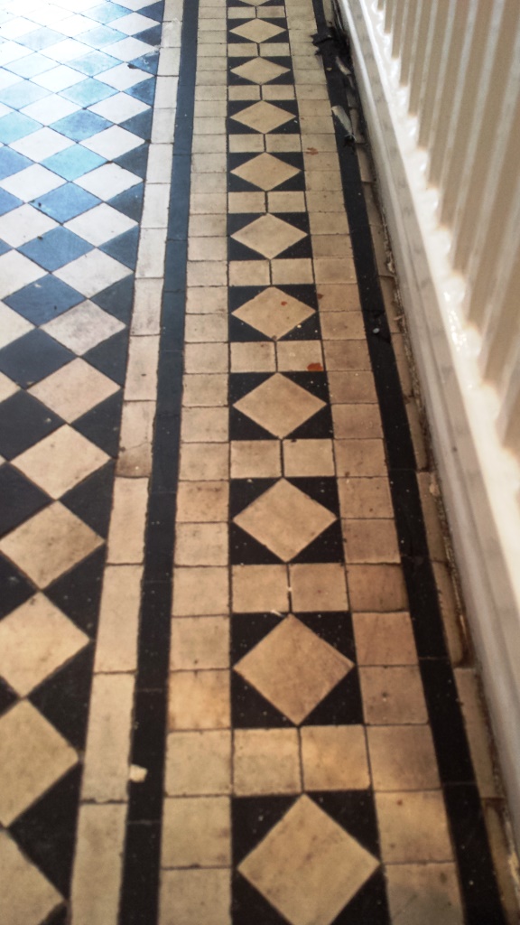 Black and white chequer Victorian Tiles Cardiff Before