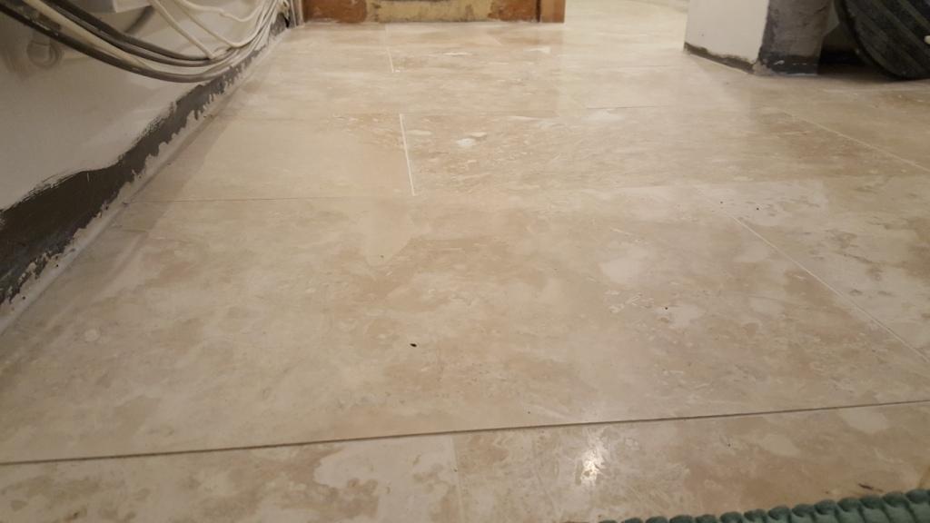 Uneven Travertine Floor Before Levelling and Polishing in Swansea