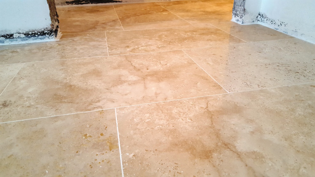 Uneven Travertine Floor After Levelling and Polishing in Swansea