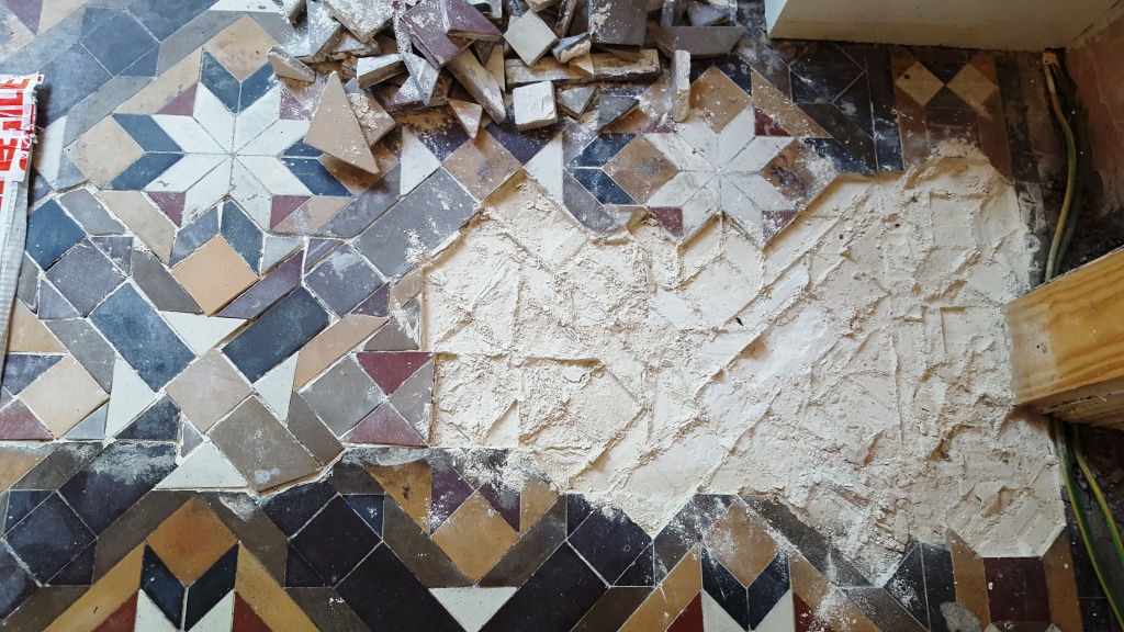 Victorian Hallway Tiles During Removal Showing Plaster Base in Newport